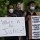 A group of protesters gather outside the home of Hennepin County Attorney Mike Freeman on May 28, 2020 in Minneapolis, Minnesota.